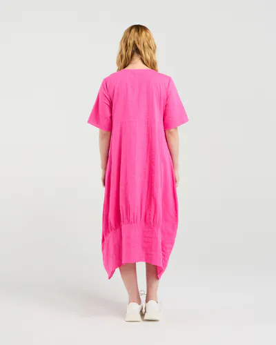 Model wearing Hot Pink Selena Dress By Seduce Available at Beetees Nelson